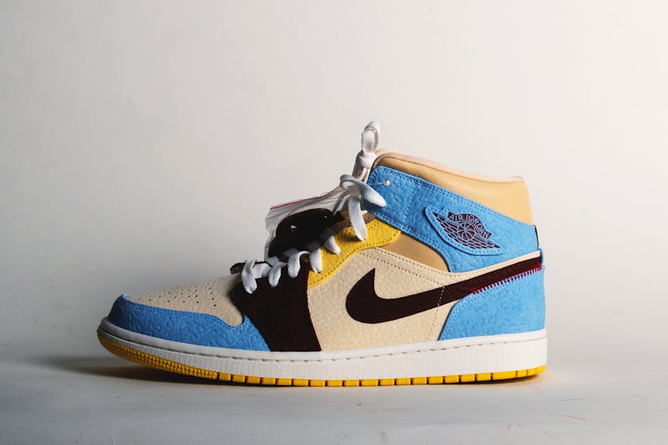 A close-up photo of a Nike sneaker with the iconic swoosh logo, which is a representation adapted from the wing of the Greek goddess Nike.