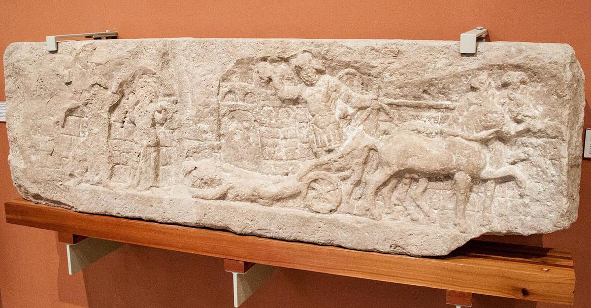 Achilles dragging Hector's body behind his chariot around Troy's walls