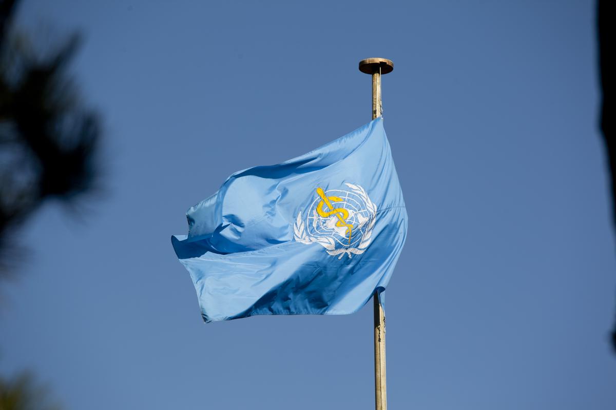 The World Health Organization logo, with the Rod of Asclepius at its center, symbolizing the global commitment to health and well-being.